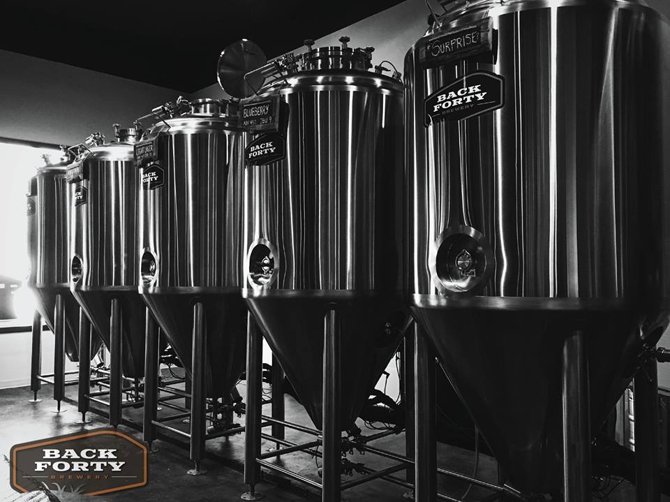 Back Forty Brewery logo design displayed on brewing equipment