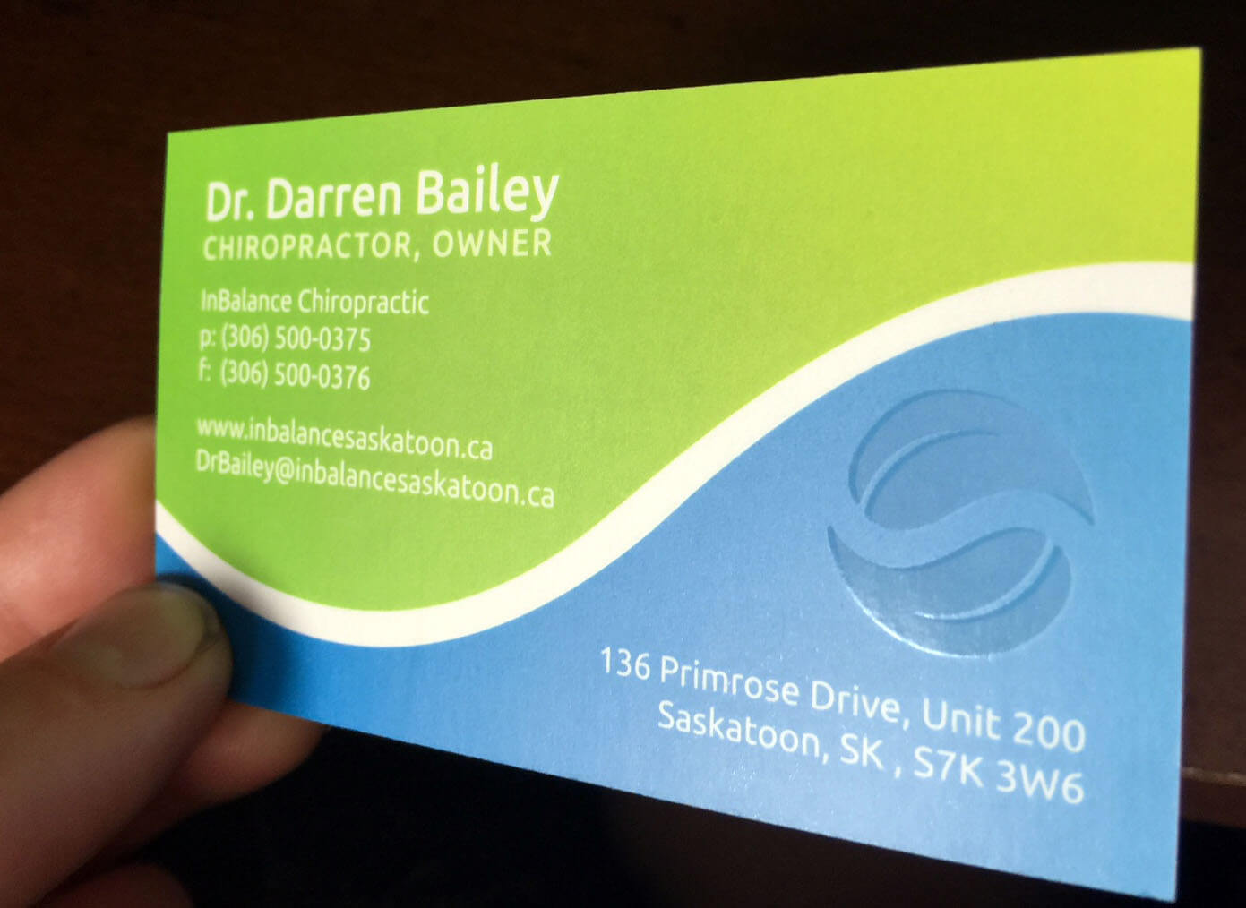 The reverse side of the InBalance business card uses bold colours