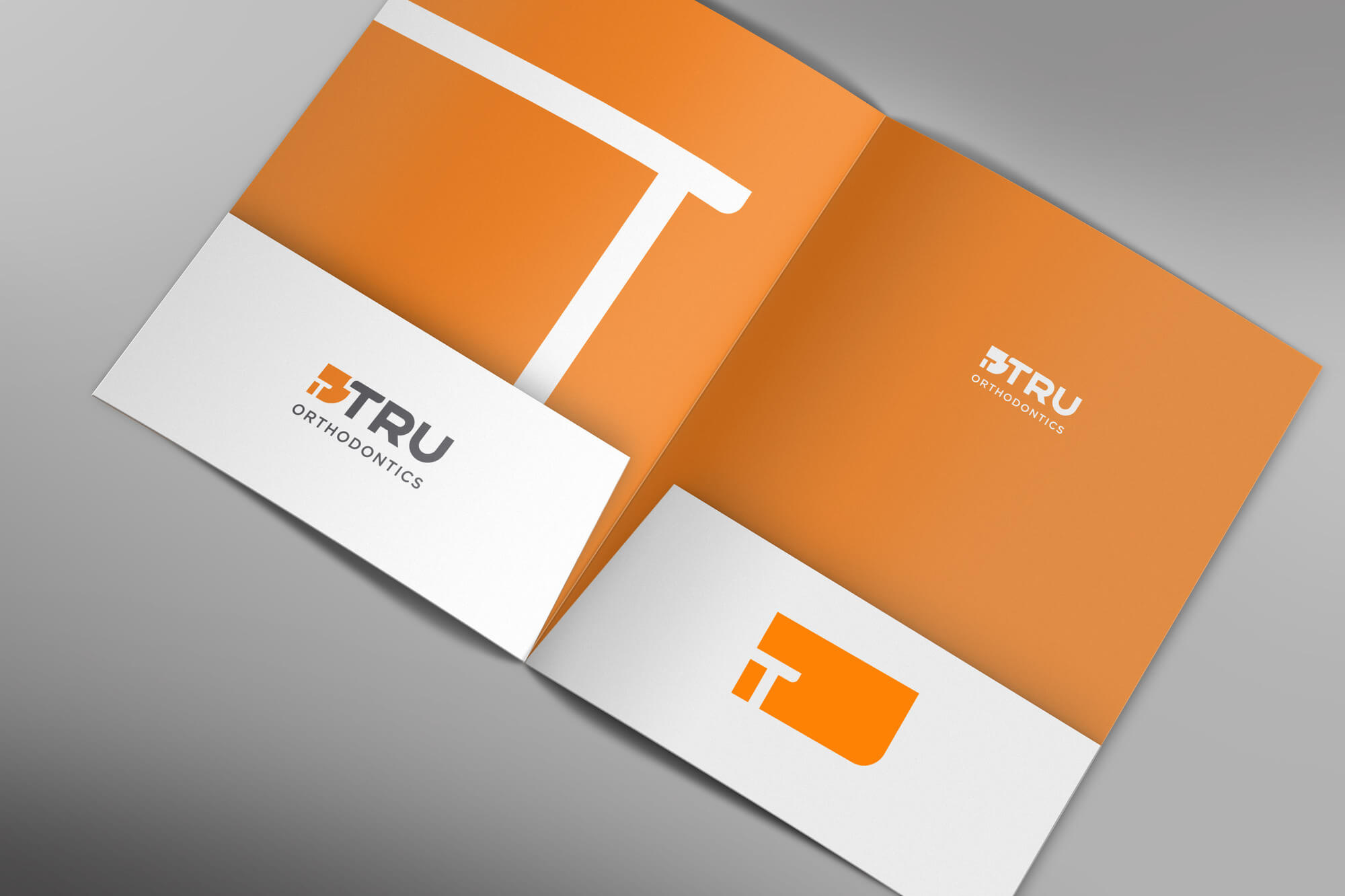 Tru-folder-inside-with-business-card-mockup A presentation folder design for Tru Orthodontics
