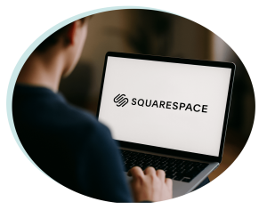 Man working on a laptop with a Squarespace logo website in front of him - Get your Discount here
