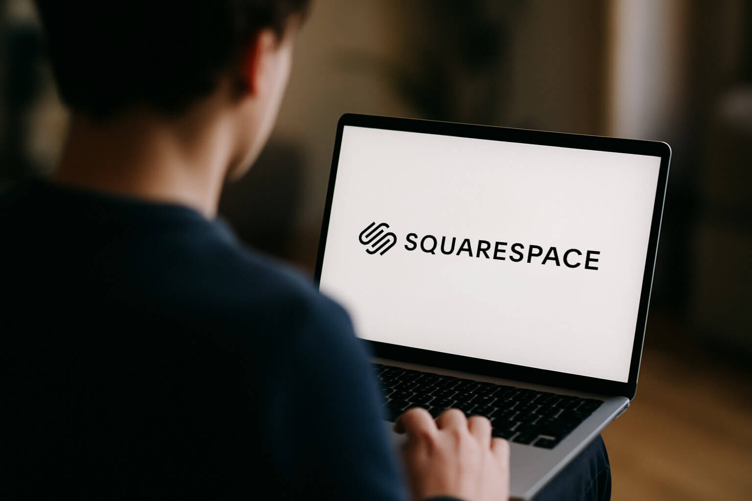 Squarespace-Laptop (2) Man working on a laptop with a Squarespace logo website in front of him - Get your Discount here